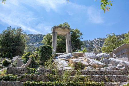 Standing column from Termessos archaeological site under a clear blue sky