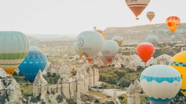 Low-altitude balloon ride in a canyon of fairy chimneys in Turkey