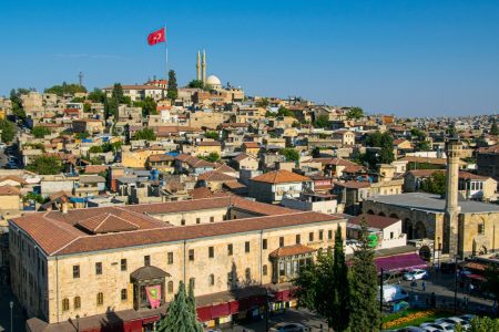 Panoramic view of Gaziantep’s old town with Turkish flag and mosque in the background