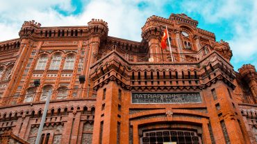 Front view of Phanar Greek Orthodox College, a historic red-brick building near the Fener Greek Patriarchate in Istanbul.