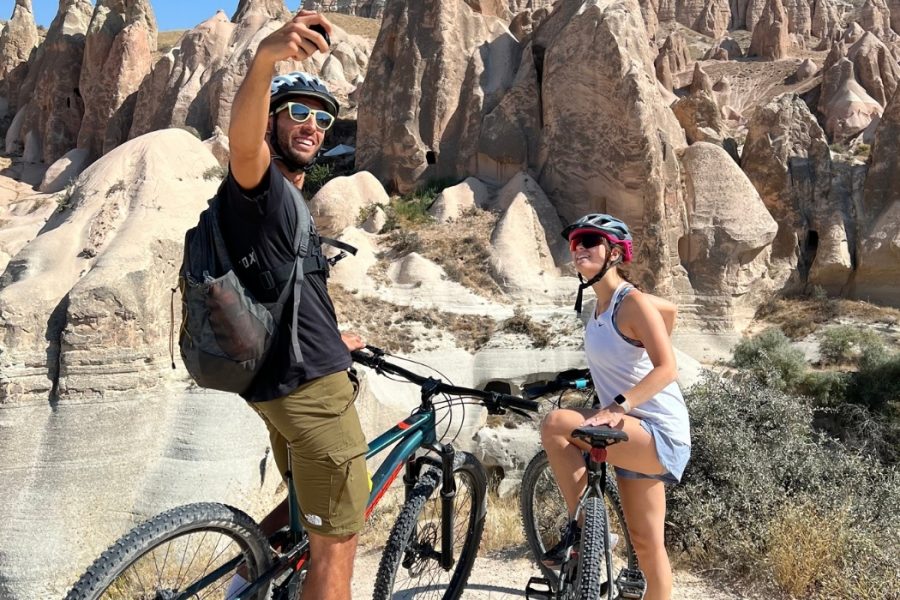 Bikers taking a selfie with fairy chimneys in Cappadocia