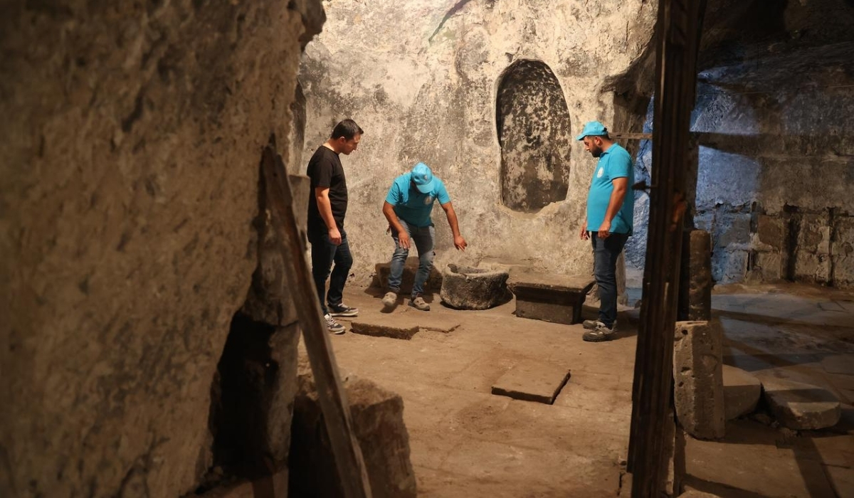 Inside Aya Maryeros Underground Monastery in Derinkuyu, Cappadocia. Workers and historians inspecting chambers of what is considered the world’s first mental hospital.